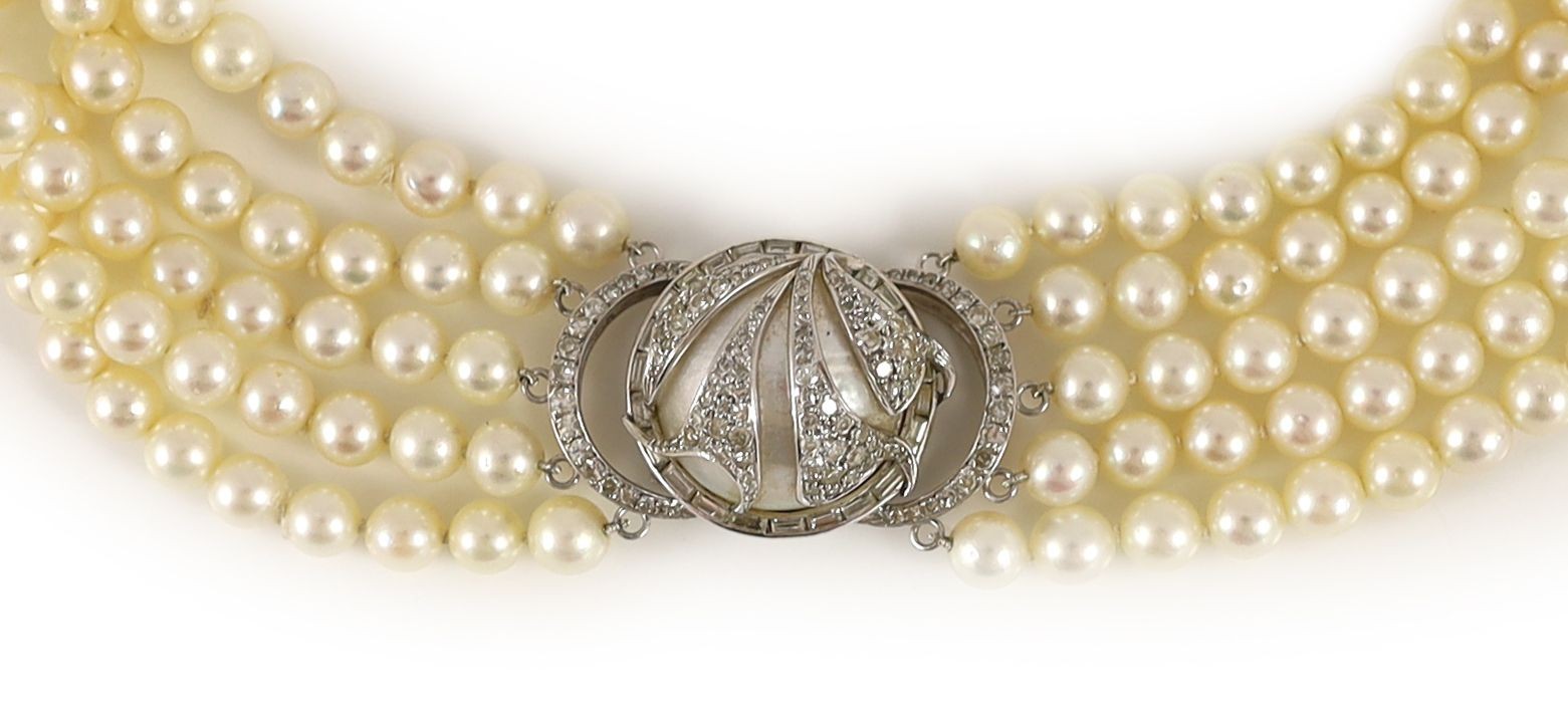 A 20th century quintuple strand cultured pearl choker necklace, with 14k, white gold and diamond set large mabe pearl clasp